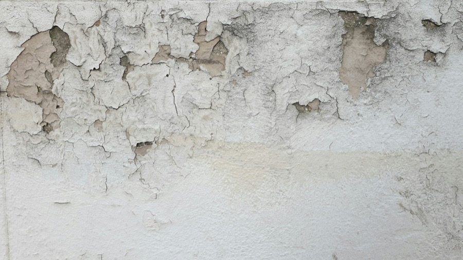 Before: paint flaking on the wall